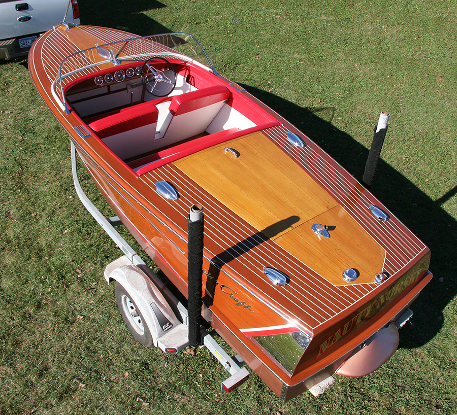 Stern view Classic Chris Craft 18' Capri Runabout with whale tale