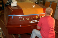 Gold leaf name on classic wooden boat